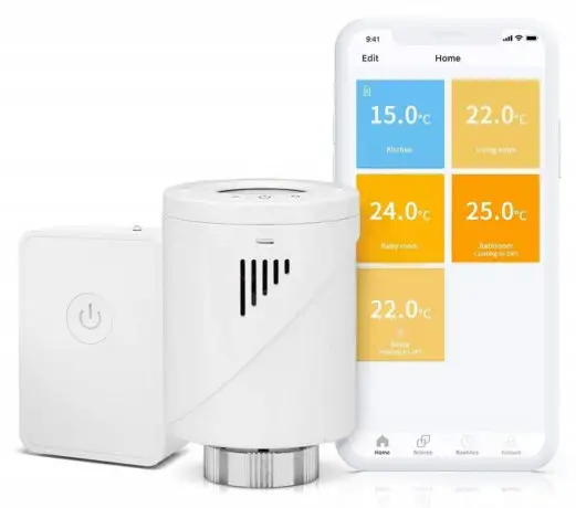 Zdjęcie przedstawia elektroniczą głowicę termostatyczną oraz smartfon na którym pokazane są ustawienia temperatur dla różnych pomieszczeń.